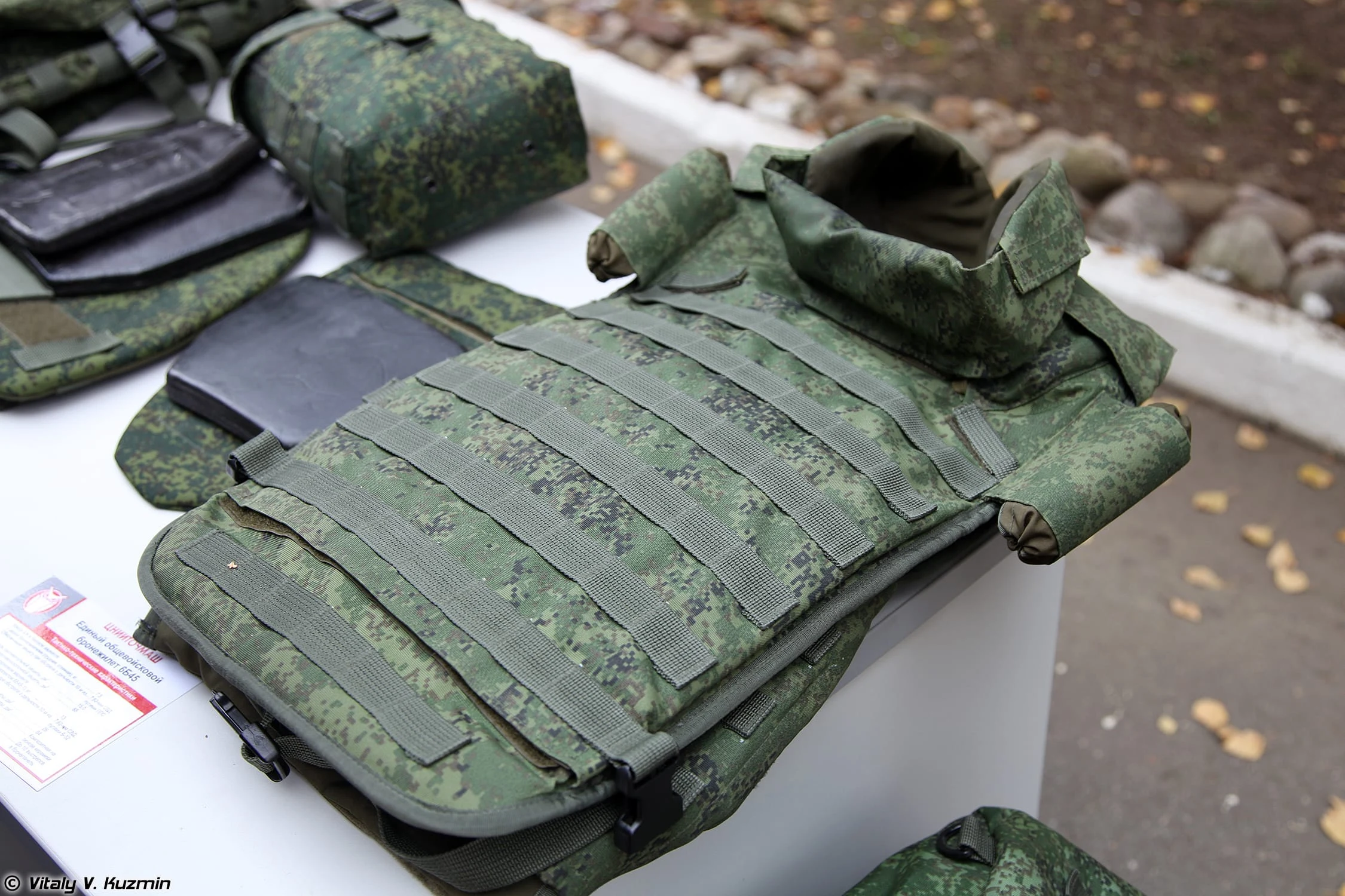 Archived illustration of a protective vest laid out with equipment